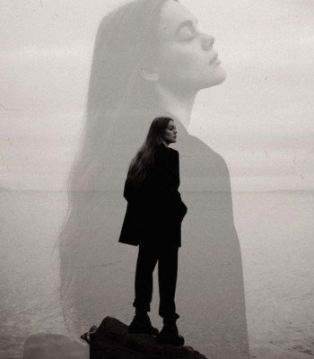 sad girl standing on beach image