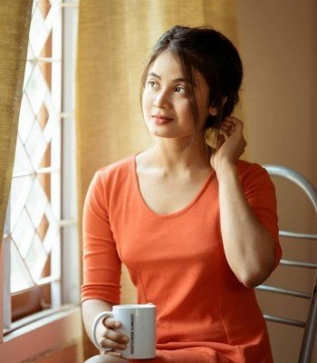 Real Simple Girl wearing orange top